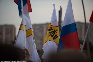 It didn’t go without a hitch, however. A few people carrying these flags (what are those?) yelled out obscenities a couple of times, but then fell silent.