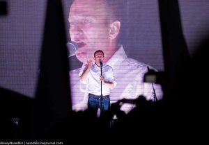 And behind the curtain was, of course, Alexey Navalny [Opposition Leader and Organizer of Event]